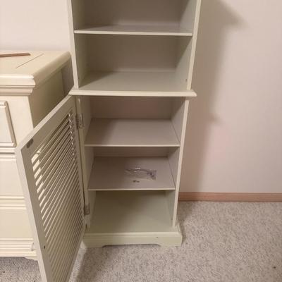 Off white colored wooden cabinet