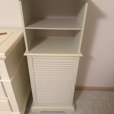 Off white colored wooden cabinet
