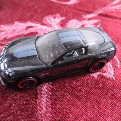 3 Hot Wheels cars, 1 Mattel car, 1 Disney car