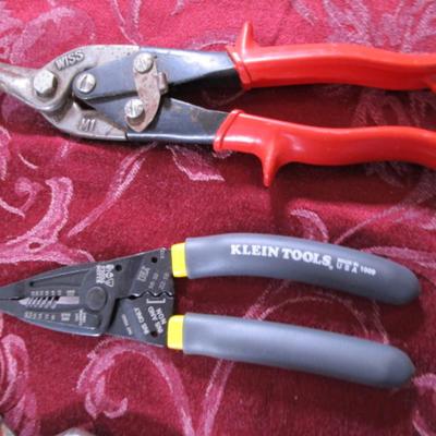 leather punch, pliers, wire stripper, tin snips