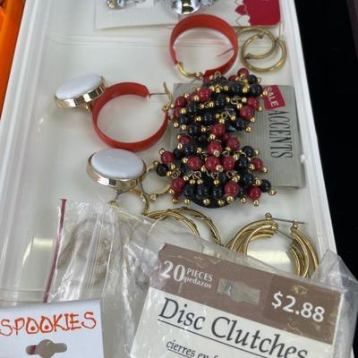 Multiple earring sets in Tupperware container