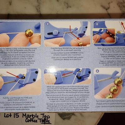 Knot a bead machine in box