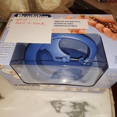 Knot a bead machine in box