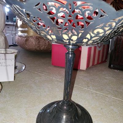 3 mini dolls sitting in silver plated dish