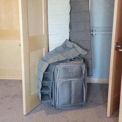 Suitcase and 3 hanging shoe racks