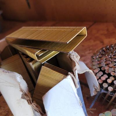 3 rolls siding nails and a box of 1/2" x 1.5" staples