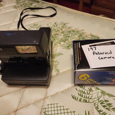 Polaroid camera with film