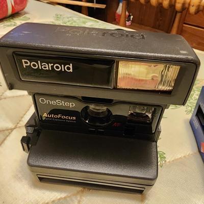 Polaroid camera with film