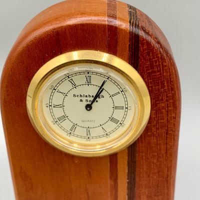 LOT 35 L: Brass Apple Bell, Schlabaugh & Sons Art Deco Miniature Desk Clock, Brass Pineapple Candle Pin, & Metal Star Decor