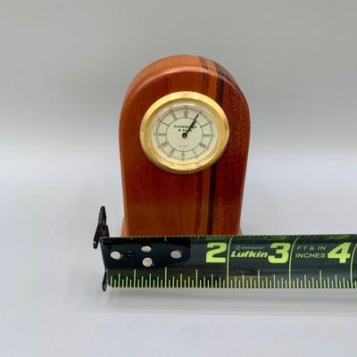 LOT 35 L: Brass Apple Bell, Schlabaugh & Sons Art Deco Miniature Desk Clock, Brass Pineapple Candle Pin, & Metal Star Decor