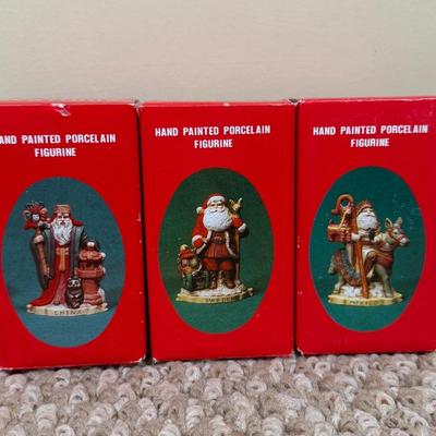 LOT 42B: Santa through the Years & Santa’s of the Nations Porcelain Figurines w/ Boxes