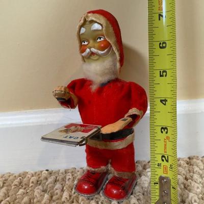 LOT 54B: Vintage 1960s Japan Tin Litho Wind Up Santa w/ Book