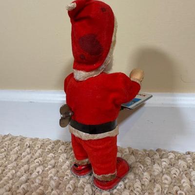 LOT 54B: Vintage 1960s Japan Tin Litho Wind Up Santa w/ Book