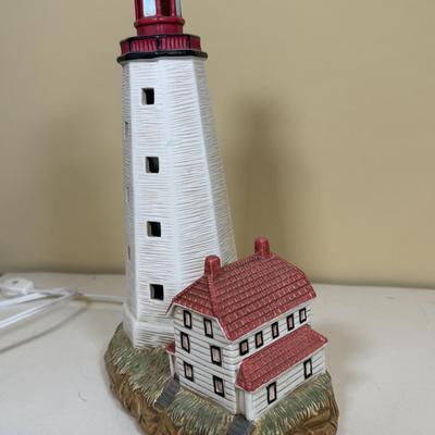 LOT 165B: Lefton Sandy Hook Lighthouse, Shaped Driftwood, Swirl Glitter Bird Sculpture, Carruth Frog Baby Sculpture & More