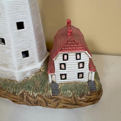 LOT 165B: Lefton Sandy Hook Lighthouse, Shaped Driftwood, Swirl Glitter Bird Sculpture, Carruth Frog Baby Sculpture & More