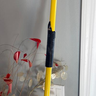 Two vases and a broom