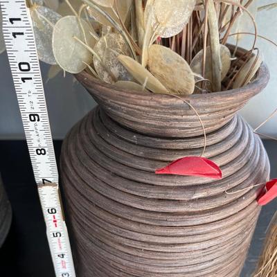 Two vases and a broom