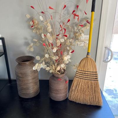 Two vases and a broom