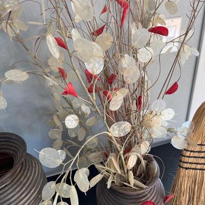 Two vases and a broom