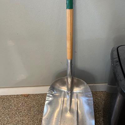 Shovel, rug and garbage can