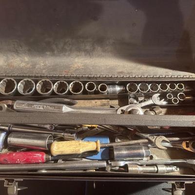 Metal Craftsman toolbox with assortment of tools