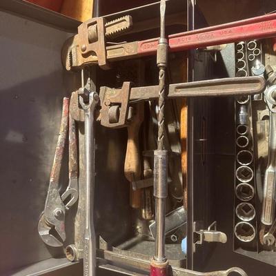 Metal Craftsman toolbox with assortment of tools