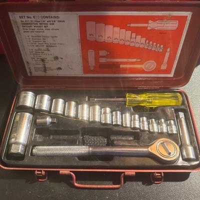 Red toolbox with random Hardware and socket set that is missing a 6 inch extension bar