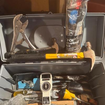 Plastic Craftsman toolbox with assortment of tools