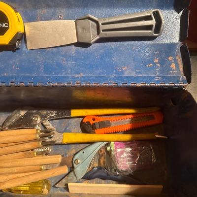 Vintage blue metal toolbox with tools