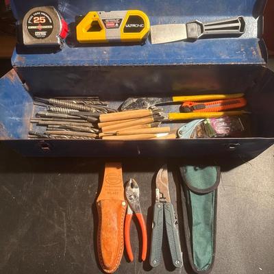 Vintage blue metal toolbox with tools