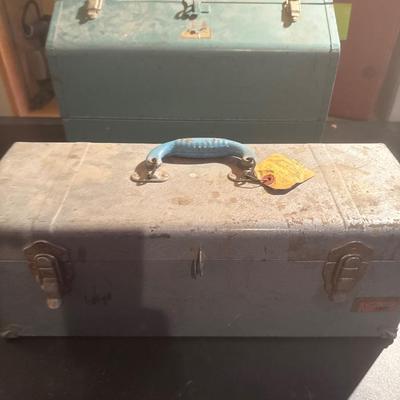 Two vintage metal toolboxes one has tools in it