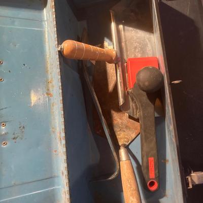 Two vintage metal toolboxes one has tools in it