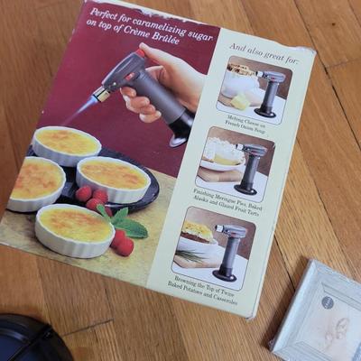 All new picture frames, new creme brulee set, lamp