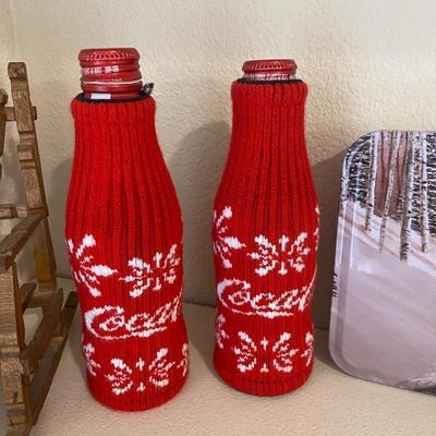 SWEATERS FOR YOUR COKE BOTTLES AND NEAT LITTLE HANDMADE ROCKING CHAIRS BUILT WITH CLOTHES PINS