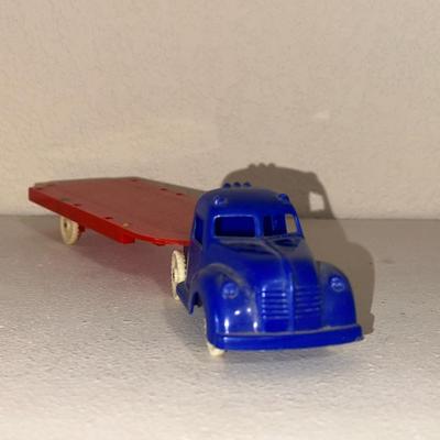1937 AUBURN RUBBER CABOVER STAKE TRUCK & PLASTIC TRUCK W/TRAILER
