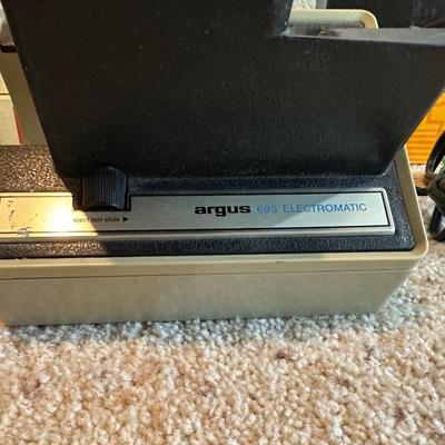 ARGUS 693 ELECTROMATIC SLIDE PROJECTOR W/VARIOUS SLIDES PLUS A PROJECTOR SCREEN