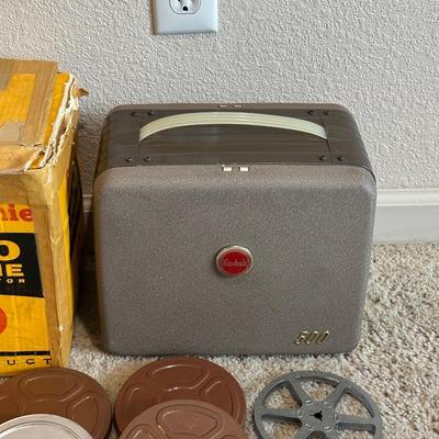 KODAK BROWNIE 500 MOVIE PROJECTOR SUPER 8 W/VARIOUS MOVIES PLUS A PROJECTOR SCREEN