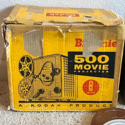 KODAK BROWNIE 500 MOVIE PROJECTOR SUPER 8 W/VARIOUS MOVIES PLUS A PROJECTOR SCREEN
