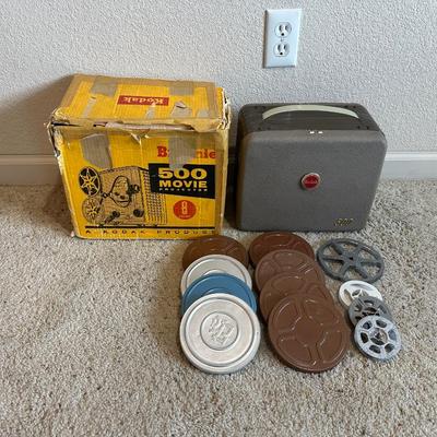 KODAK BROWNIE 500 MOVIE PROJECTOR SUPER 8 W/VARIOUS MOVIES PLUS A PROJECTOR SCREEN
