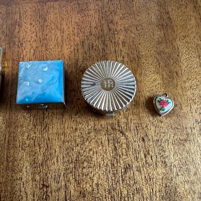 2 PILL CASES, CHIPS, HEART LOCKET AND A PEN