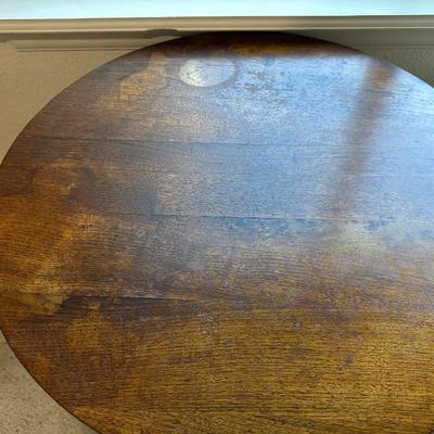ROUND MAHOGANY SIDE TABLE W/BRASS CLAW FEET AND A CERAMIC POODLE