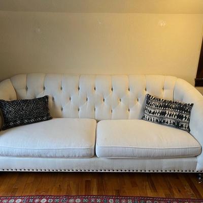 Dwellings White Tufted Sofa and Matching Swivel Armchair