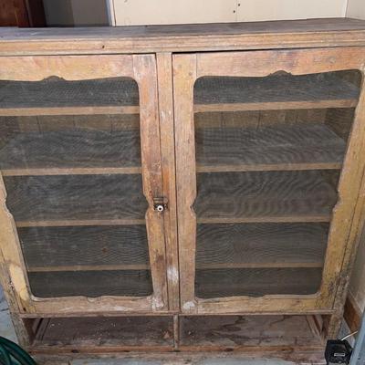 Vintage wooden cabinet with screen front
