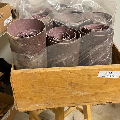 Wood crate of drum sanding paper rolls