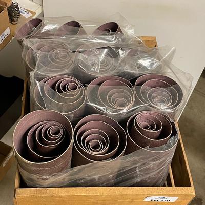 Wood crate of drum sanding paper rolls