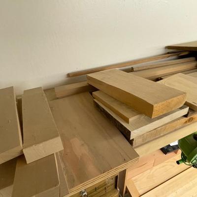 Long shelf full of nice wood pieces