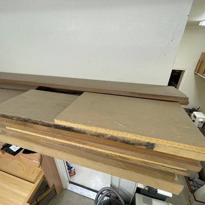 Long shelf full of nice wood pieces