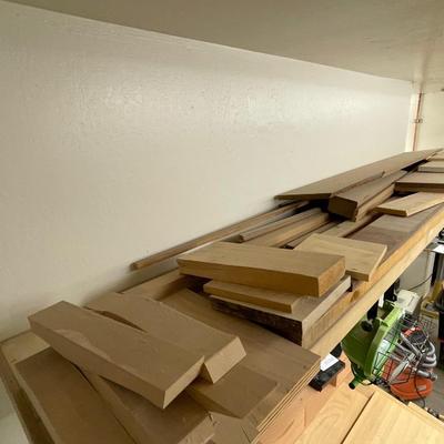 Long shelf full of nice wood pieces