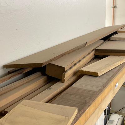 Long shelf full of nice wood pieces