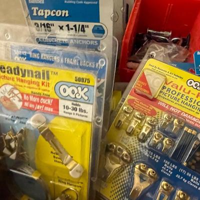 Box of misc screws/picture hanging kits & more